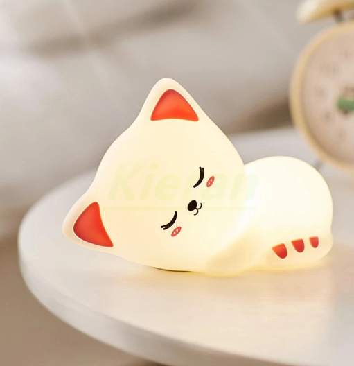 LED Night Light Lamp Kitten laying on table with clock behind it