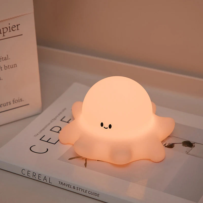 Cute octopus-shaped night light on a book
