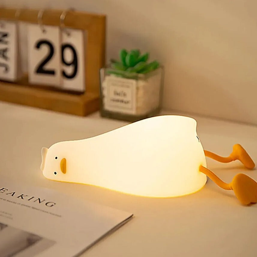 LED Night Light Lamp duck laying on top of desk