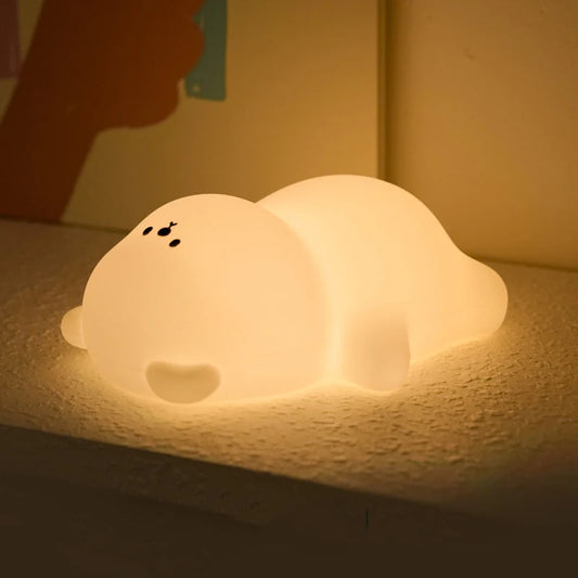 Warm Glowing LED Lamp shaped like a bear lying on a counter