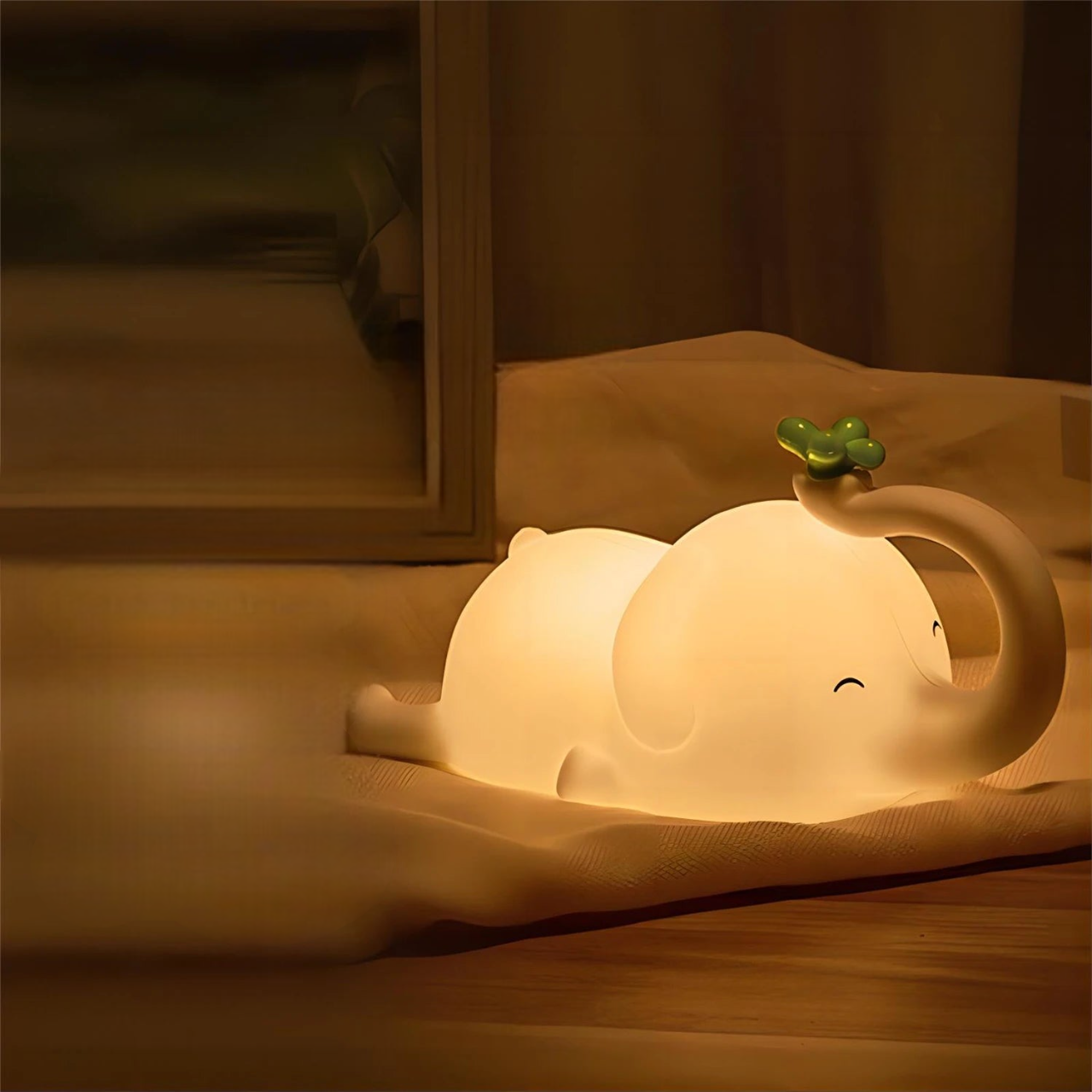 Glowing Elephant LED Lamp on a Carpet in a Bedroom