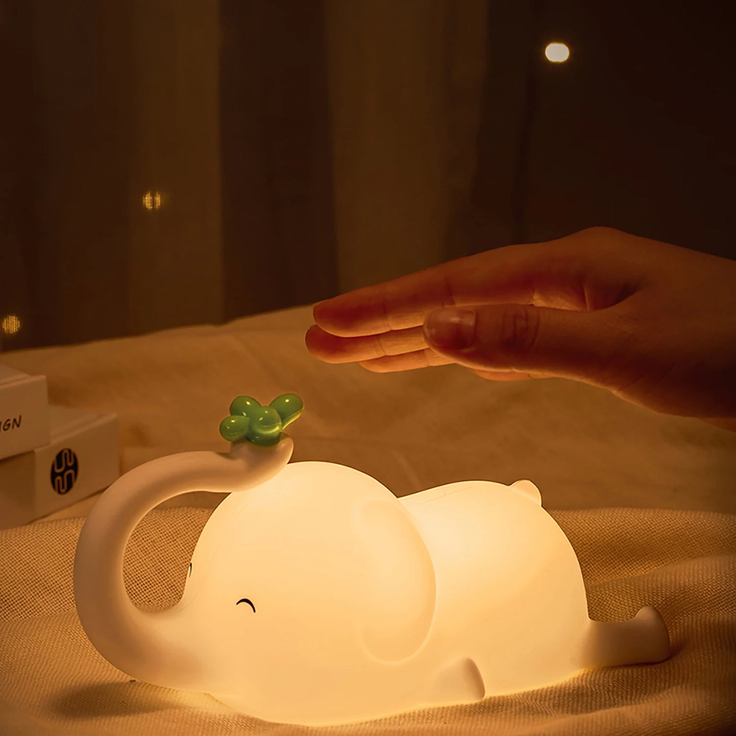 Elephant Shaped LED Lamp Glowing on a Bed
