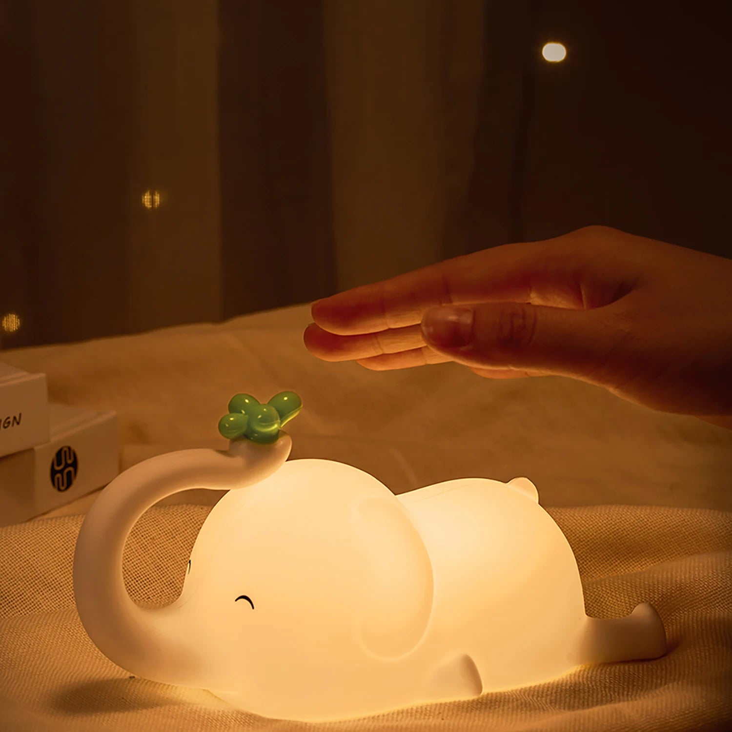 Elephant Shaped LED Lamp Glowing on a Bed