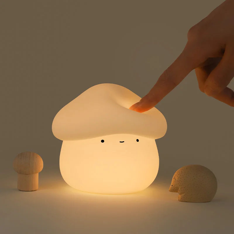 Fantastic fungi-shaped night light with a hand touching it on a dark background