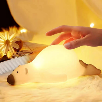 Polar bear LED Lamp glowing on a bed 