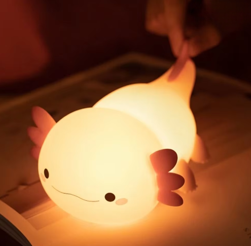 Axolotl Lamp Glowing on a Book