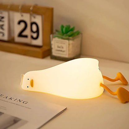 LED Night Light Lamp duck laying on top of desk