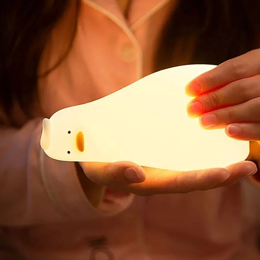 LED Night Light Lamp duck laying in someone's hands