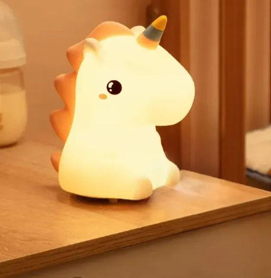 Unicorn LED lamp illuminating a bedside table