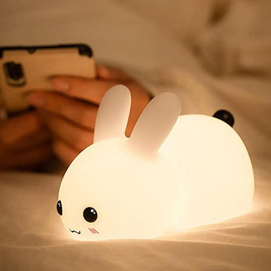 Bunny LED lamp illuminating a child's bed in a bedroom