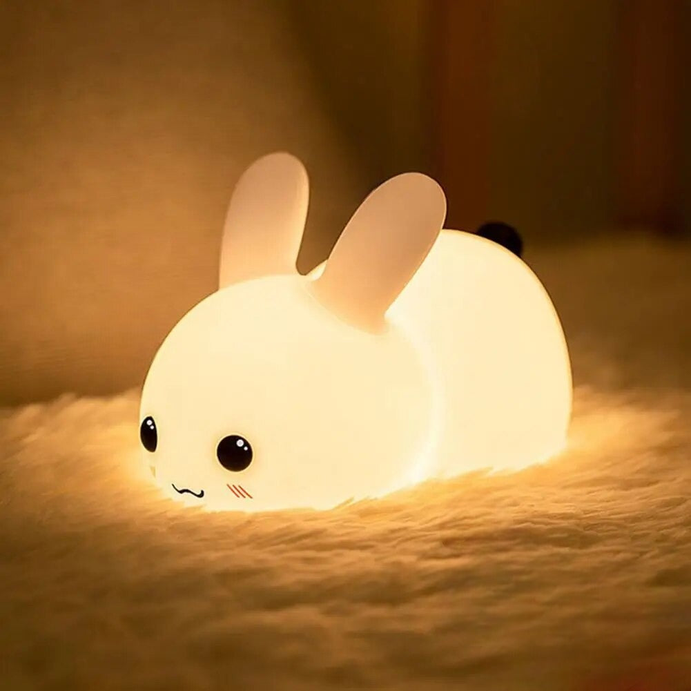 Pudgy Bunny LED Lamp illuminating a fluffy bedsheet 