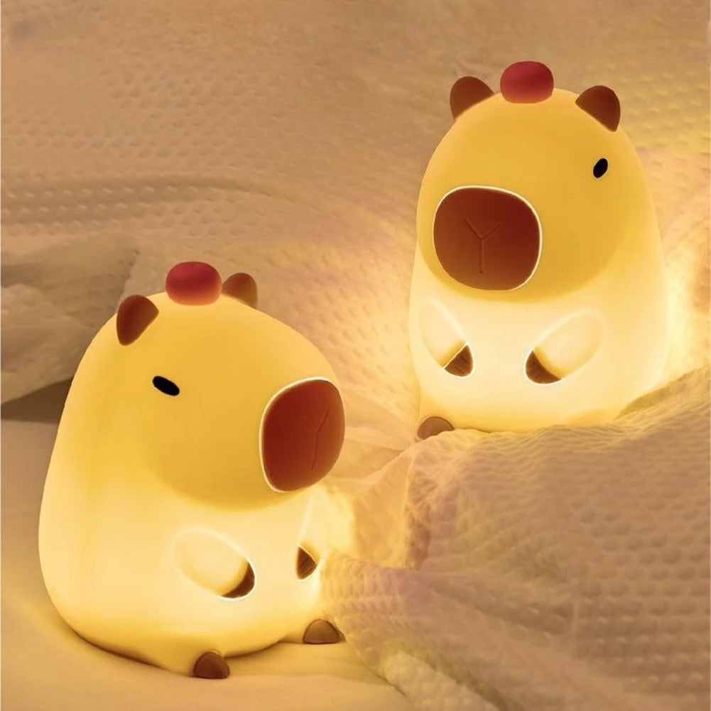 Two Capybara LED Lamps illuminating a bed 