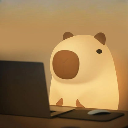 Capybara LED lamp at a table 