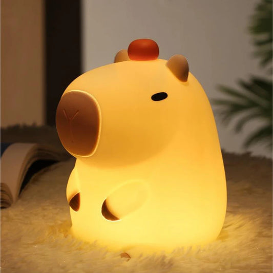 Glowing Capybara LED lamp on a fluffy bed sheet